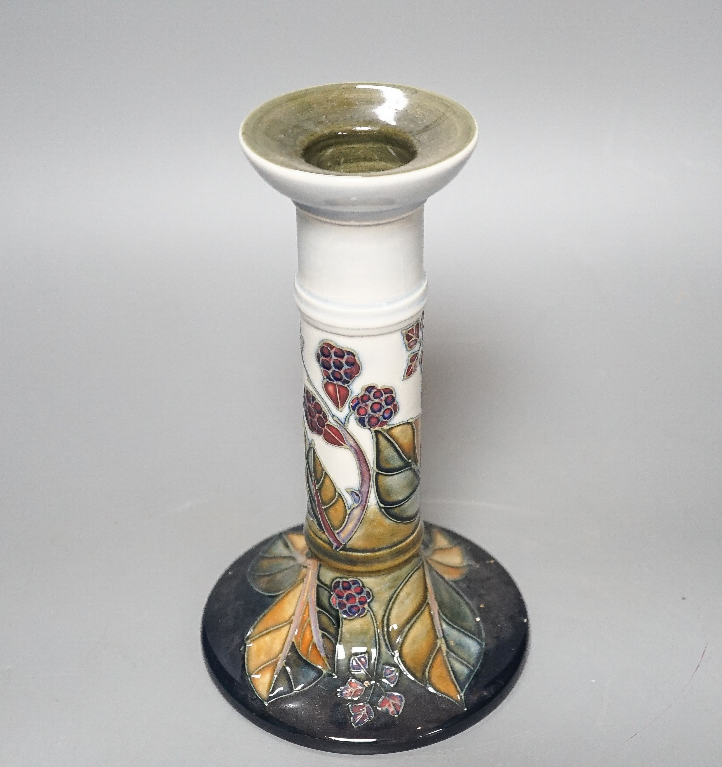 A Moorcroft bramble pattern candlestick 21cm